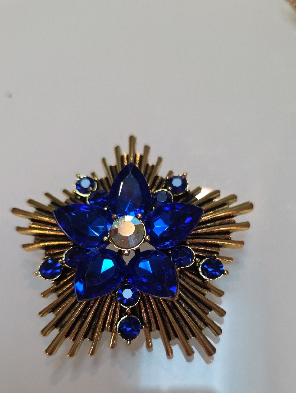 Gold Tone Brooch with Deep Blue Crystal Flower